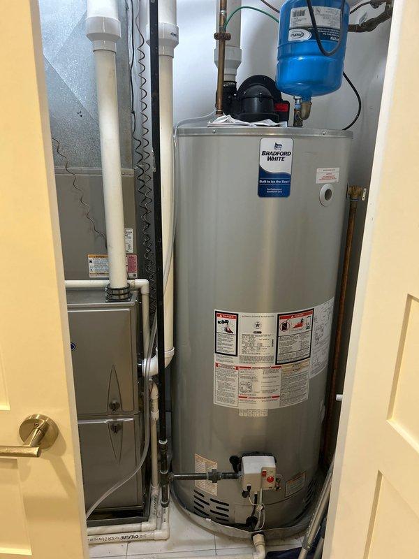 Performed VIP maintenance on Bradford White water heater, including inspection of tank, connections, and expansion tank. Checked humidifier as requested and verified proper operation of all components. System appears to be in good working condition with proper installation of all plumbing connections.