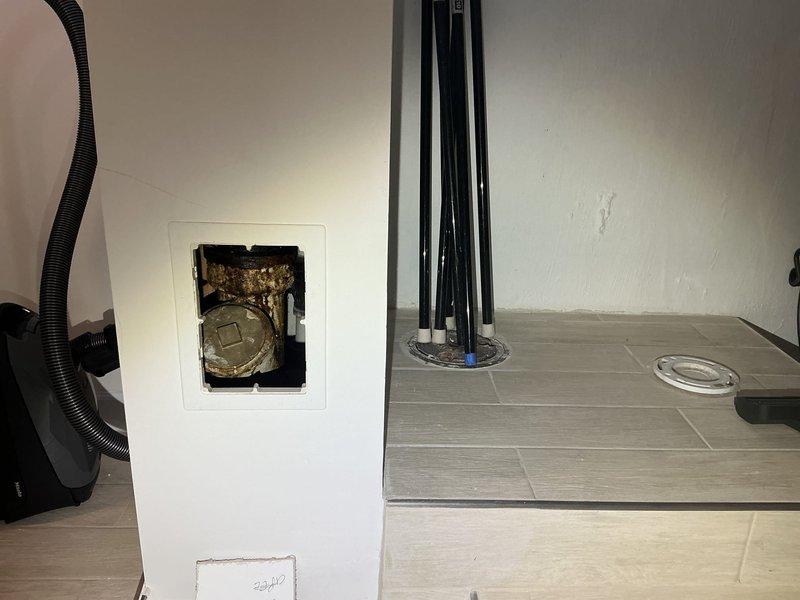 Conducted comprehensive camera inspection of plumbing system, focusing on utility access points with brass shut-off valves and PVC piping with red valve handles. Inspected sump pump basin and associated drainage components for proper functionality. Identified areas with discoloration and potential corrosion requiring attention.