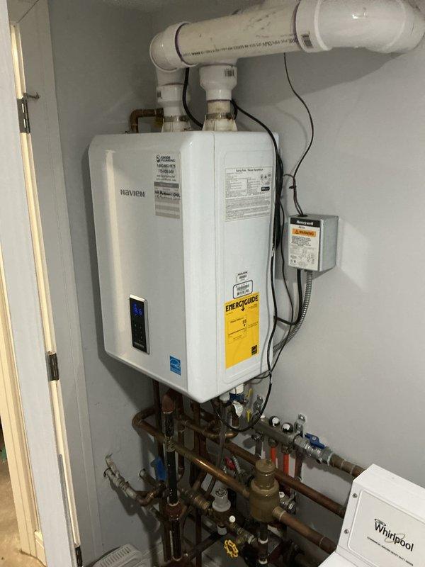 Responded to service call for Navien tankless water heater displaying error code E.351 with no hot water output. Diagnosed and resolved the issue, restoring proper functionality to the unit. System is now operating correctly with all connections secure and venting properly.
