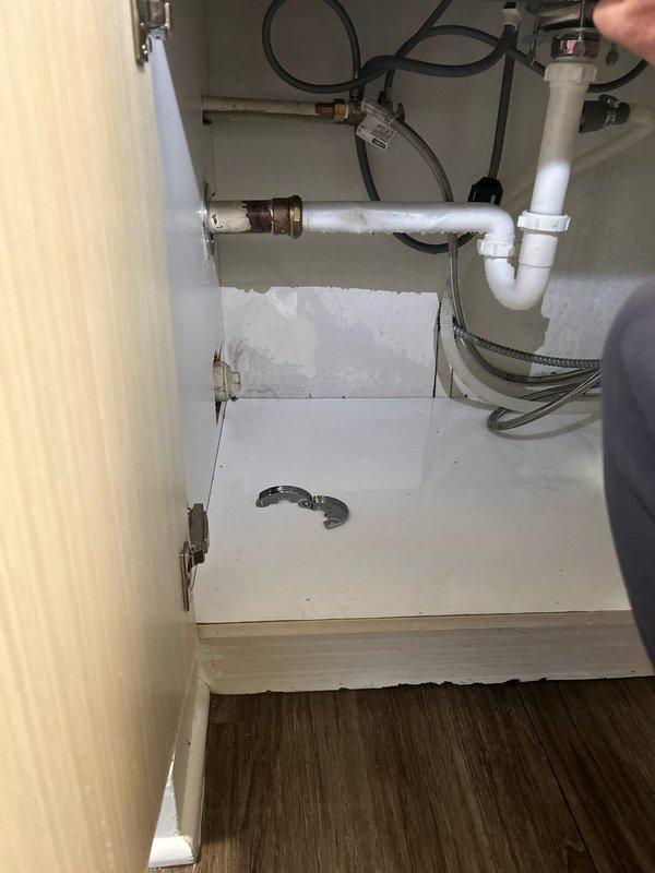 Responded to emergency call for burst pipe under kitchen sink. Upon inspection, discovered copper supply line with corrosion damage causing leak within cabinet space. Replaced damaged section of copper pipe with appropriate fittings, tested system for proper water pressure and absence of leaks, and verified cabinet interior sustained minimal water damage with no structural compromise to surrounding cabinetry.