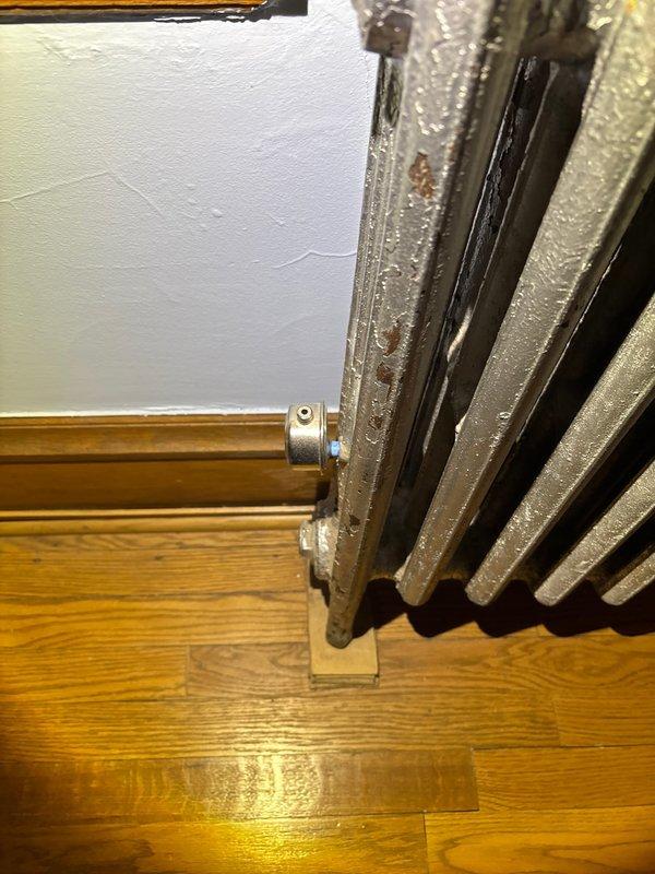 Inspected steam radiator system exhibiting severe banging and hissing noises despite previous valve replacement. Discovered improper air venting causing steam distribution issues and pressure imbalance. Installed appropriately sized air vent valve and adjusted system pressure to optimal levels, significantly reducing noise while maintaining heating efficiency.