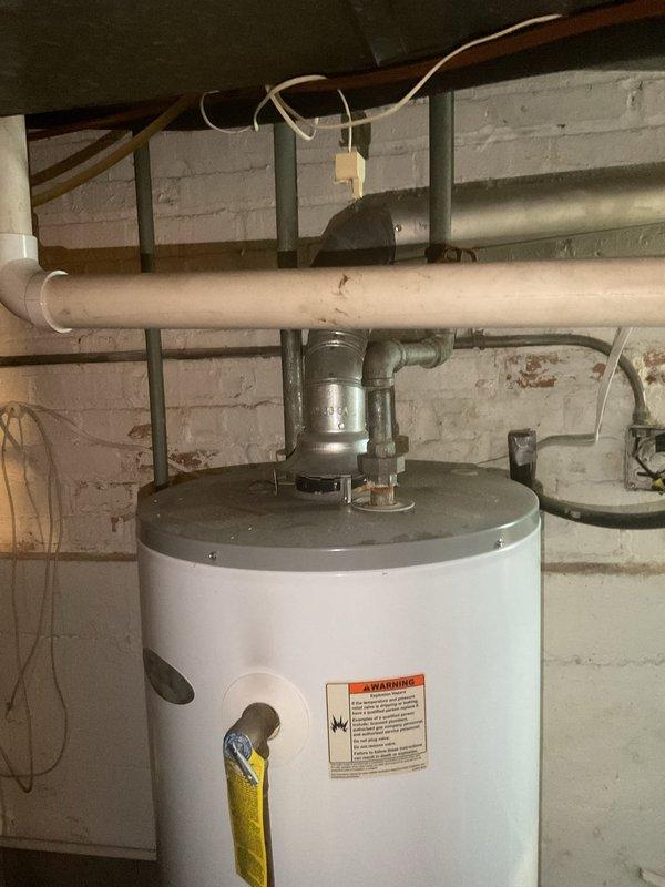 Responded to service call for tanked water heater with intermittent pilot light issues. Upon inspection, discovered and cleaned debris from thermocouple and pilot assembly. Verified proper gas supply and ventilation. After servicing, tested unit through multiple heating cycles, confirming stable pilot light operation and proper burner ignition. Unit now functioning correctly with all safety systems operational.