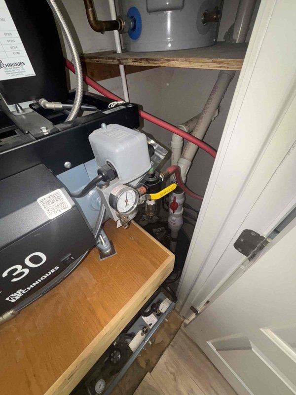 Inspected failed sump pump in office location. Observed significant water damage to wooden platform and surrounding area. Recommended complete replacement of existing pump unit due to deterioration and moisture infiltration affecting the mechanical components.