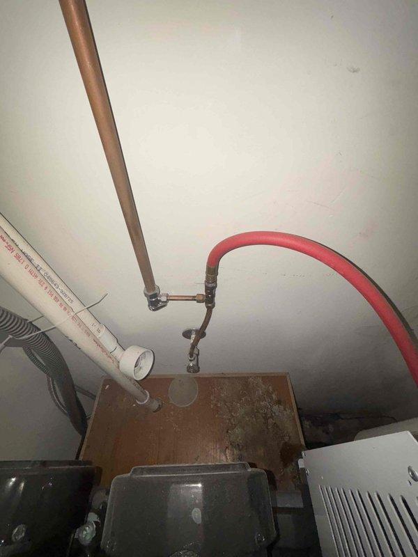 Inspected failed sump pump in office location. Observed significant water damage to wooden platform and surrounding area. Recommended complete replacement of existing pump unit due to deterioration and moisture infiltration affecting the mechanical components.