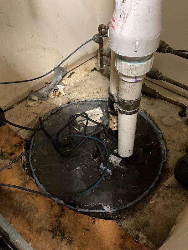 Assessed commercial ejector pump system requiring replacement. Existing sump pit installation showed signs of wear with accumulated moisture and dirt. Scheduled follow-up appointment to install new ejector pump with check valve, which will require temporarily relocating dental suction pump to gain proper access to the installation area.