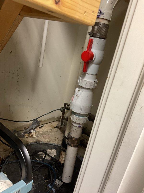 Assessed commercial ejector pump system requiring replacement. Existing sump pit installation showed signs of wear with accumulated moisture and dirt. Scheduled follow-up appointment to install new ejector pump with check valve, which will require temporarily relocating dental suction pump to gain proper access to the installation area.