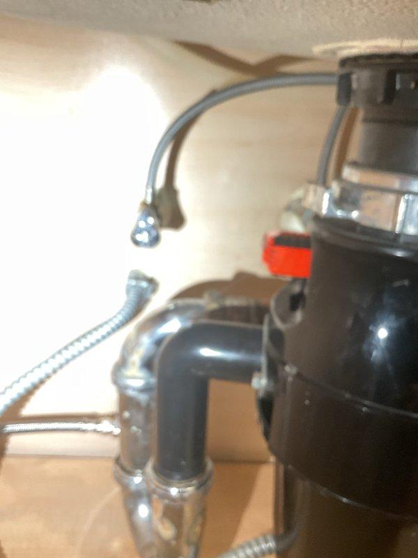Completed scheduled building shutdown to address cold temperature issues. Successfully restored proper water flow to kitchen sink faucet, verifying functionality of pull-down sprayer and checking for leaks. Inspected garbage disposal unit and drain system connections, confirming all plumbing components are properly secured and operational.