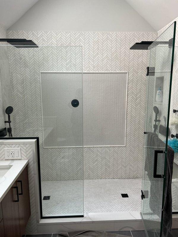 Performed leak investigation for a VIP client reporting water damage on kitchen ceiling directly below a recently remodeled bathroom (2022). Visual inspection revealed water staining on kitchen ceiling between recessed lighting fixtures. Located source of leak in the shower installation with herringbone tile backsplash and dual shower head system. Completed necessary repairs to resolve the water infiltration issue.