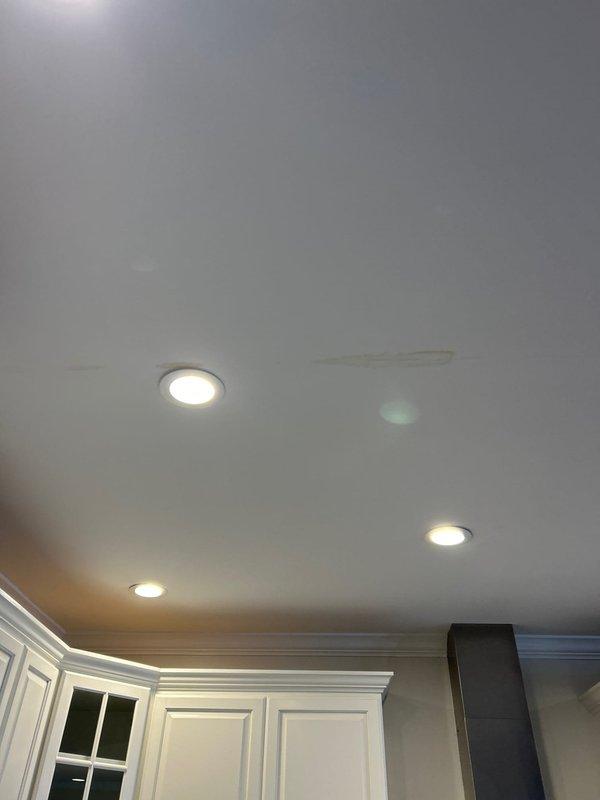 Performed leak investigation for a VIP client reporting water damage on kitchen ceiling directly below a recently remodeled bathroom (2022). Visual inspection revealed water staining on kitchen ceiling between recessed lighting fixtures. Located source of leak in the shower installation with herringbone tile backsplash and dual shower head system. Completed necessary repairs to resolve the water infiltration issue.