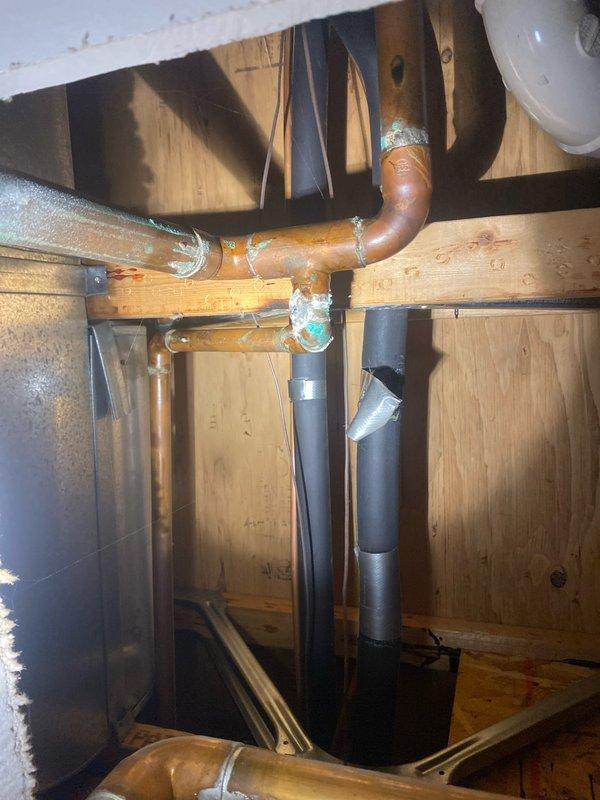 Installed new tankless water heater system with Energy Star certification, replacing corroded copper pipe infrastructure. Connected unit to existing plumbing, installed water filtration component with appropriate insulation, and set up pressure regulation system with control valve. System was tested and confirmed operational with digital control panel functioning properly.