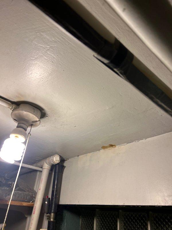 Investigated low water pressure issue at kitchen sink. Discovered significant pipe corrosion causing internal blockage, evidenced by metal shavings in drain line. Identified water damage on ceiling below, indicating possible leak in drainage system. Replaced corroded section of supply line and installed new P-trap assembly to restore proper water flow and prevent further deterioration.