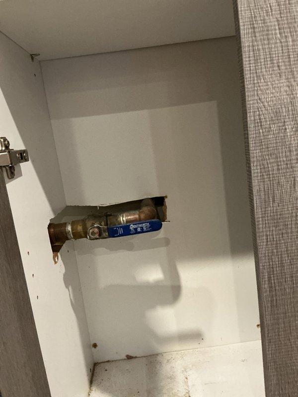 Responded to service call for frozen pipes resulting in no water flow. Inspected the City of Chicago water meter installation and associated plumbing components. Located and verified operation of the main shutoff valve with blue handle, then performed necessary thawing procedures to restore water service to the property.