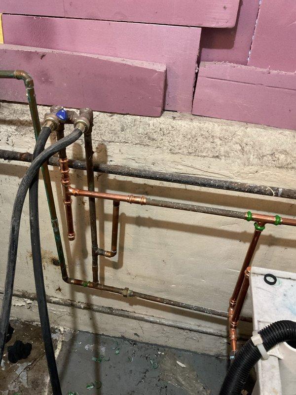 Responded to emergency call for burst pipe in basement. Upon inspection, found significant aging and corrosion in existing metal plumbing system with visible water damage to surrounding wall. Replaced damaged section with new copper piping, installed brass valve fitting for improved flow control, and secured all connections. Verified system integrity with pressure test; no leaks detected.
