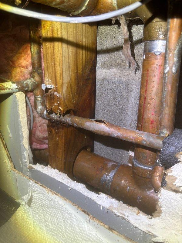 Responded to frozen pipe emergency. Opened wall section to access affected copper supply lines, which showed signs of freezing and condensation. Applied controlled heat to thaw pipes and installed additional insulation around exposed plumbing to prevent future freezing issues.