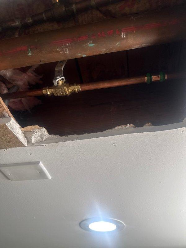 Investigated water leak in basement. Located and repaired burst copper supply pipe in ceiling cavity. Verified proper function of exterior spigot connection and confirmed system integrity after repair. No further leakage observed.