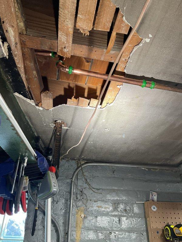 Responded to customer call regarding a leaking copper pipe previously installed. Inspection revealed water damage to ceiling requiring access holes to be cut for proper assessment. Identified faulty ProPress fittings at connection points of the horizontal copper line. Warranty status was evaluated as requested by customer.