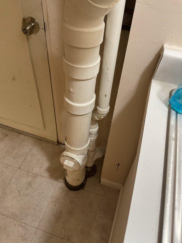 Responded to service call for basement drain backup caused by root intrusion. Accessed the drain system through exterior cleanout point (visible in snowy conditions) and utilized mechanical drain cleaning equipment to clear root blockage. Successfully restored proper drainage function in the basement plumbing system.