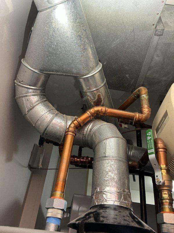 Responded to warranty service call for relatively new water heater with intermittent pilot light failure (staying lit for approximately 30 minutes before extinguishing). Performed diagnostic inspection of the unit located in wall enclosure, examining copper supply lines, thermocouple, and control assembly. Identified and corrected issue with pilot assembly, restoring proper functionality to ensure continuous hot water supply.