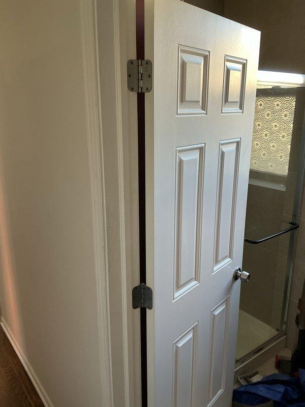 Assessed existing bathroom for plumbing modifications to accommodate new vanity installation, requiring sink plumbing relocation. Additionally, evaluated shower system for valve and fixture replacement. Current shower features standard chrome control knob with wall-mounted installation in tiled enclosure.