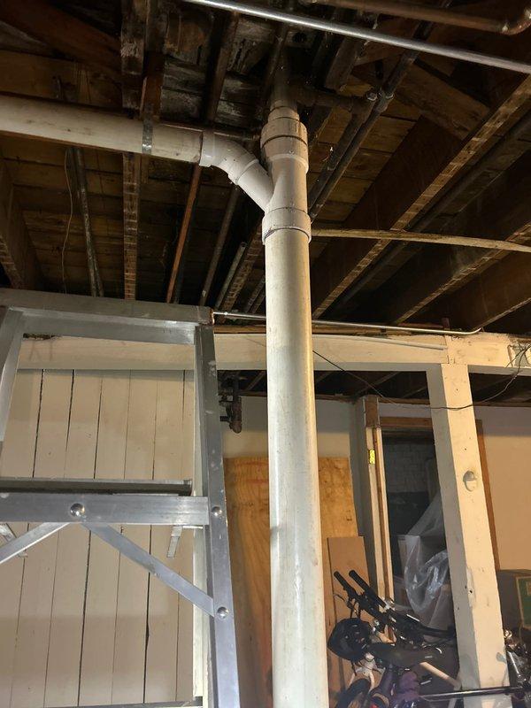 Responded to complaint of leaking sink pipes causing water damage in basement. Upon inspection, discovered deteriorated piping connections with visible corrosion and water damage to surrounding wooden joists. Replaced affected sections of plumbing with new PVC pipe, including installation of proper coupling joints to ensure watertight connections. Verified system integrity with pressure test after repairs were completed.