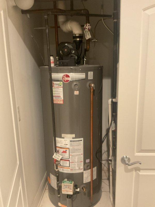 Performed maintenance service on Rheem tankless water heater system that supplies radiant floor heating. Addressed loose exterior venting pipes that were leaking, resealing and securing all PVC vent connections. Inspected circulation pump, expansion tank, and associated brass valves/fittings. Verified proper operation of the tankless unit itself, which was functioning correctly. All components now properly sealed and operational.