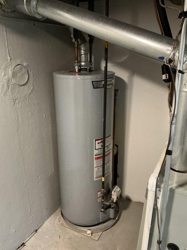 Conducted inspection of residential property to diagnose cloudy water issues affecting multiple bathrooms. Identified potential drainage system problems, documented current water heater installation, and examined floor drain with significant sediment buildup and blockage. Prepared estimate for floor drain removal as requested by customer.