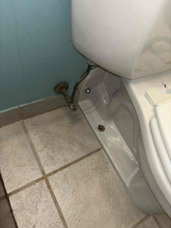 Responded to priority service call for toilet with leakage at base. Removed toilet, replaced deteriorated wax ring that was causing water seepage onto tile floor, and reinstalled toilet with proper seal. Confirmed proper function with no further leakage at the toilet-floor junction.
