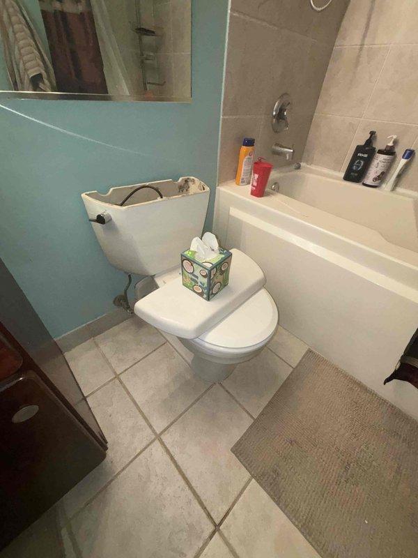 Responded to priority service call for toilet with leakage at base. Removed toilet, replaced deteriorated wax ring that was causing water seepage onto tile floor, and reinstalled toilet with proper seal. Confirmed proper function with no further leakage at the toilet-floor junction.