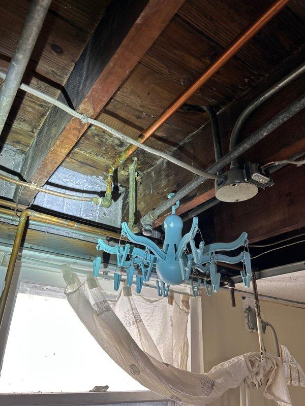 Responded to customer report of water leak in basement. Upon inspection, observed water seepage coming from copper supply line in exposed ceiling area. Identified pinhole leak at joint connection where copper pipe meets valve assembly. Repaired compromised section by replacing damaged pipe segment and installed new soldered joint fitting. Pressure tested system to confirm successful repair with no further leakage detected.
