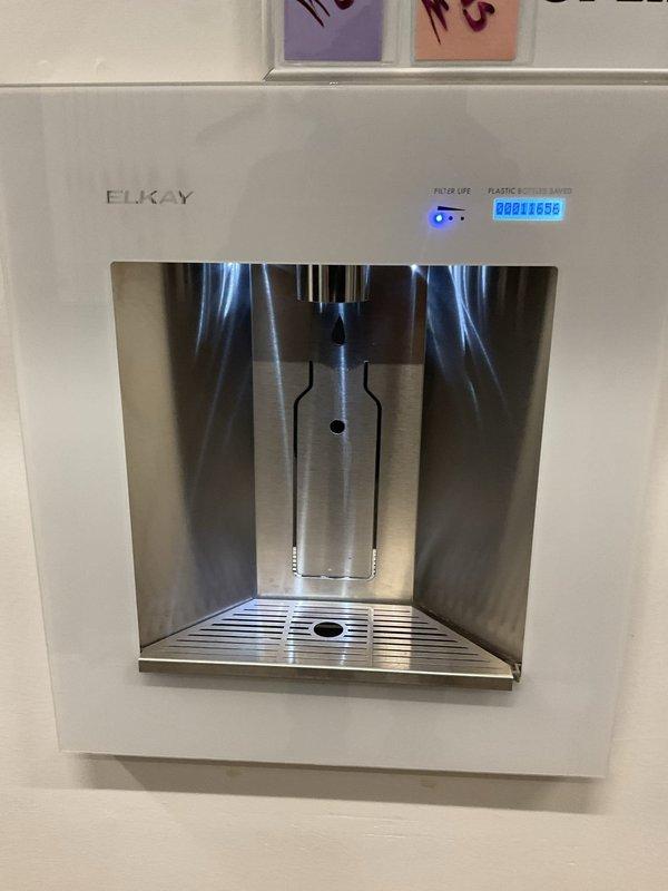 Performed diagnostic assessment of Elkay water fountain unit that was dispensing water without activation. Inspected sensor system and dispensing mechanism. Identified faulty sensor as cause of continuous water flow. Unit's usage counter displayed 11,656 cycles.
