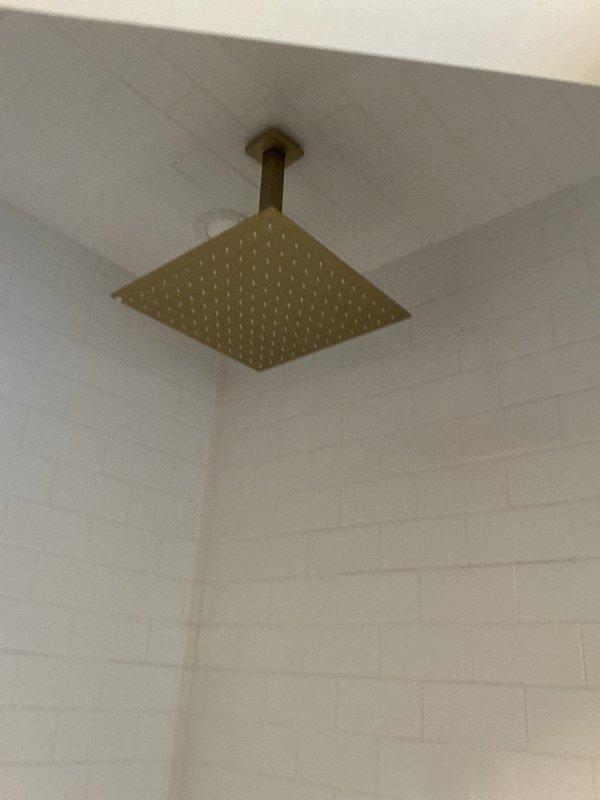 Responded to priority service call for low water pressure in shower that persisted after customer's cartridge replacement. Conducted diagnostic testing with electronic pressure gauge to identify system pressure irregularities. Inspected brass rainfall shower head, cleared mineral buildup from water distribution nozzles, and adjusted flow regulator to restore proper water pressure.