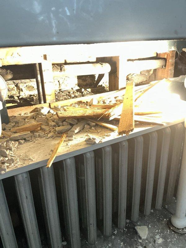 Responded to morning service call for frozen pipes. Upon inspection, discovered damage beneath the structure with affected radiator and plumbing components. Completed necessary repairs to restore proper function to bathroom sink plumbing system and associated radiator. Documented condition with photos for service record.
