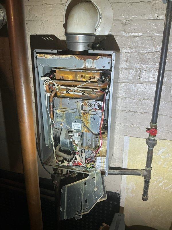 Responded to no hot water complaint for tanked water heater system. Upon inspection, found internal wiring and connection issues in the control compartment. Replaced damaged electrical components and restored proper operation of heating elements. System now functioning correctly with hot water production verified before departure.