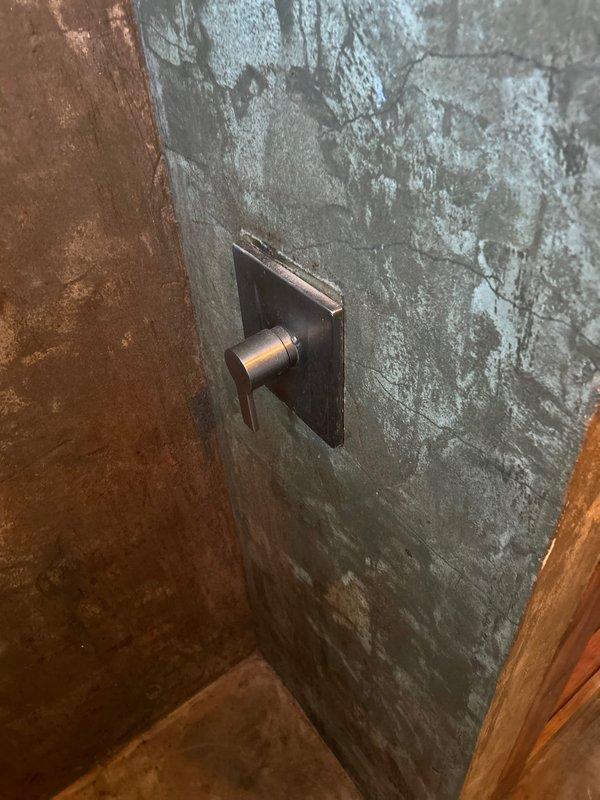 Responded to emergency call regarding frozen and burst pipes reported by neighbor with active leaking. Upon arrival, inspected bathroom fixtures including shower control unit and toilet. Restored water supply, repaired damaged pipe sections, and verified proper operation of all plumbing fixtures. Ensured no residual leakage before completing service.