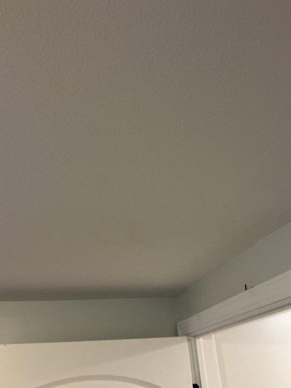 Responded to water leak service call for a VIP client who reported a brown spot on laundry room ceiling. Upon inspection, identified source of leak coming from the shower enclosure in the bathroom above, with water penetrating through the floor/ceiling junction due to deteriorated shower door seal and track. Documented ceiling water damage and shower condition with photos for client records.