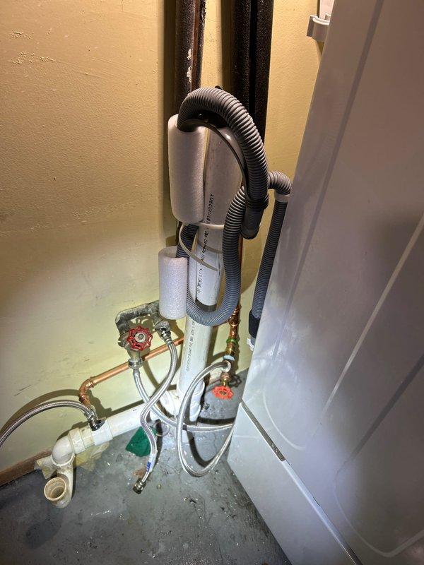 Responded to water leak call and identified source at copper pipe joint in utility room. Repaired compromised section of pipe using metal tape to seal the leak. Inspected surrounding plumbing system including water heater connections, PVC drainage, and flexible supply lines to ensure no additional leaks were present. All valves and fittings were tested for proper operation after repair.