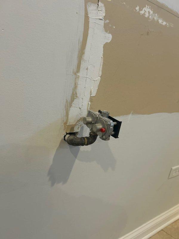 Responded to service call to cap off a gas line in customer's basement. Inspected existing gas meter installation and associated piping. Successfully installed a gas shutoff valve on the target line, securing the system and ensuring no gas leakage. Wall repair around the installation area was initiated but remains in progress.