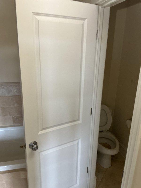 Responded to customer complaint regarding foreign object in main stack affecting building drainage. Visual inspection conducted of bathroom with standard toilet and bathtub installation. Further investigation required to locate and extract the reported pipe, after which comprehensive estimates for piping replacement will be provided.
