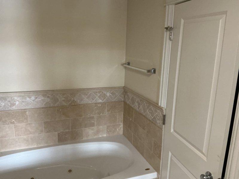 Responded to customer complaint regarding foreign object in main stack affecting building drainage. Visual inspection conducted of bathroom with standard toilet and bathtub installation. Further investigation required to locate and extract the reported pipe, after which comprehensive estimates for piping replacement will be provided.