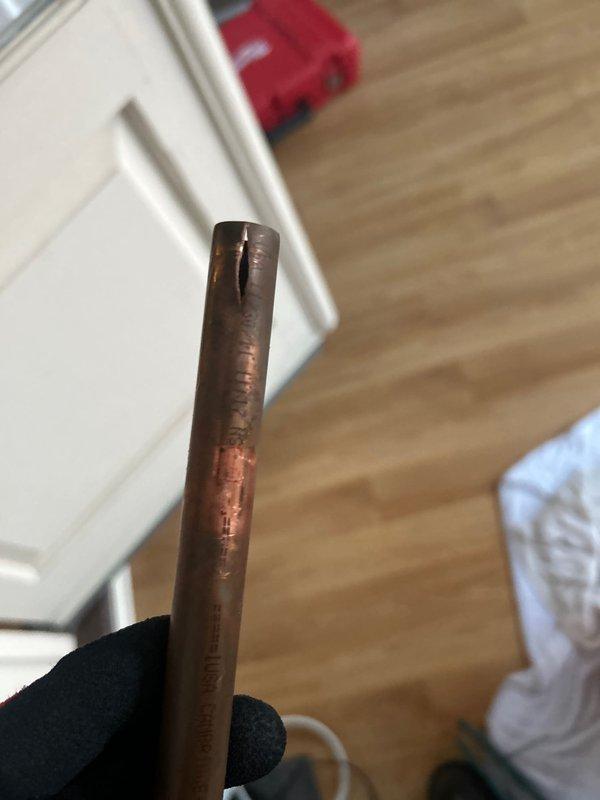Responded to emergency call for burst copper pipe in screened porch area that extends to basement. Removed damaged section of pipe which showed signs of oxidation and wear. Installed new copper supply line with proper wall mounting bracket and connected to existing water faucet fixture on brick wall, restoring water service to the area.