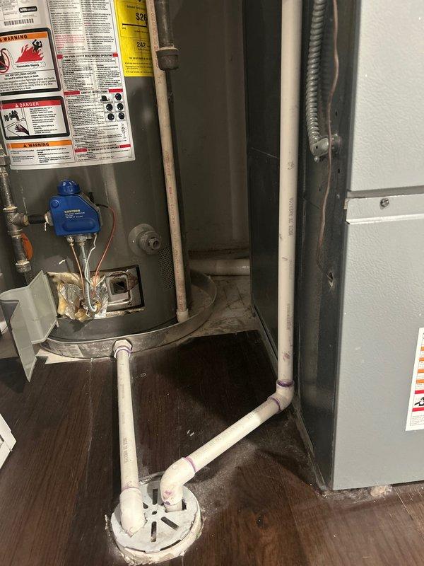 Responded to service call for a tank water heater (6+ years old) with extinguished pilot light. Upon inspection, reignited pilot light and verified proper operation. Performed safety check of all connections, valves, and ventilation components. Noted standard installation with appropriate drainage system and plumbing connections intact.