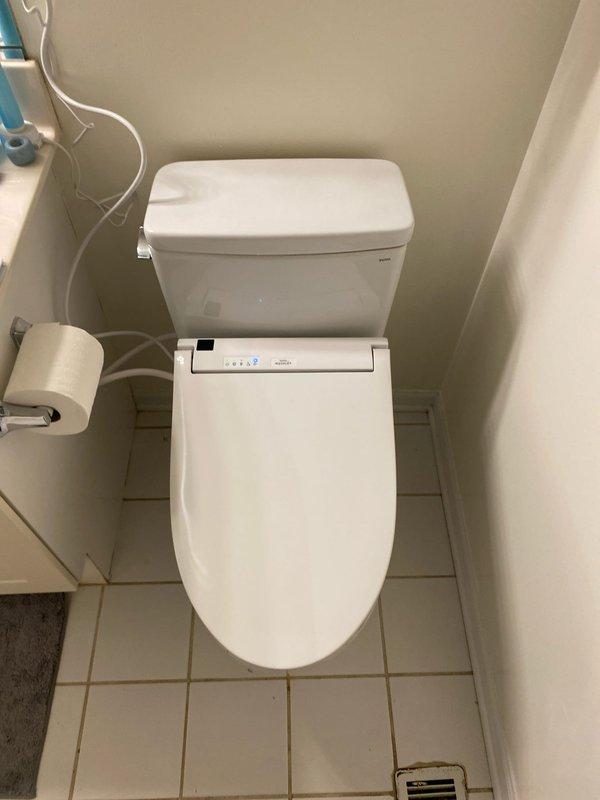 Successfully installed two Toto Drake elongated toilets with 12" rough-in measurements. Connected client-supplied Toto electronic bidets, ensuring proper water supply connections and secure fixture mounting. Verified all components for proper function and leak-free operation.