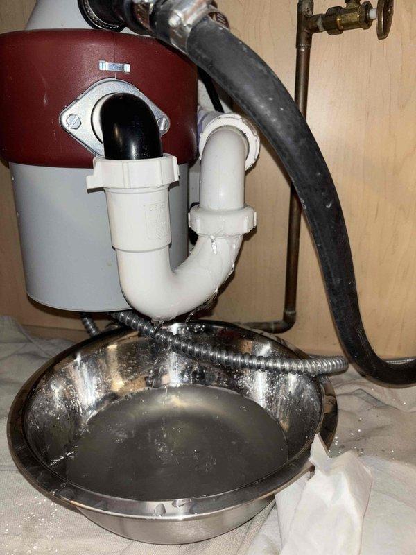 Responded to service call for multiple kitchen sink drainage issues in three-unit condo building. Diagnosed severe main line blockage causing backflow into dishwasher and sink drains. Cleared obstruction using professional-grade drain cleaning equipment, restored proper drainage to all affected units, and verified system functionality by testing all connected fixtures.