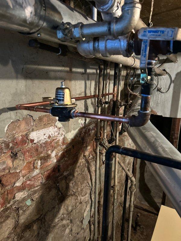 Responded to service call for frozen pipe affecting boiler system and heating functionality. Inspected the Weil-McLain boiler unit and associated plumbing network, identifying ice blockage in copper supply lines. Successfully thawed affected pipes using controlled heat application and restored proper water flow, returning the heating system to normal operation.