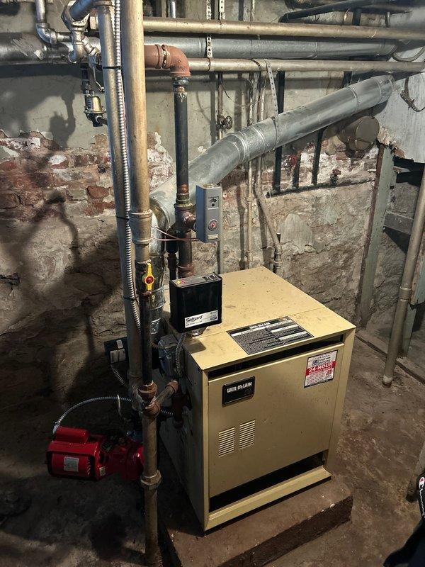 Responded to service call for frozen pipe affecting boiler system and heating functionality. Inspected the Weil-McLain boiler unit and associated plumbing network, identifying ice blockage in copper supply lines. Successfully thawed affected pipes using controlled heat application and restored proper water flow, returning the heating system to normal operation.