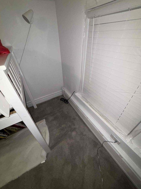Responded to emergency water leak call where water was penetrating through ceiling light fixtures. Inspection revealed structural damage with a cracked wooden beam in the building framework, likely the source of the leak. Repaired damaged section and verified no additional water intrusion to surrounding areas including carpeted rooms with window installations.