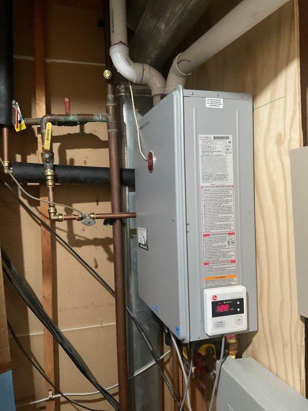 Diagnosed tankless water heater displaying error code 180. Inspected gas supply, water connections, and ventilation system. Cleaned scale buildup from heat exchanger and flushed system to restore proper operation. Unit now producing consistent hot water with normal temperature regulation.