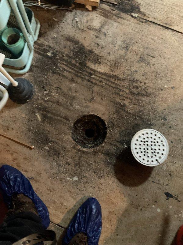 Responded to emergency call for sewage backup in customer's bathtub. Inspected the plumbing system and located access point in wooden floor. Exterior examination revealed evidence of blockage in the main sewer line. Recommended professional drain cleaning service to clear the obstruction and prevent further backups.