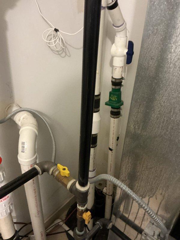 Diagnosed and corrected cross-connection issue causing hot water to flow into cold water lines. Inspected Navien tankless water heater system and associated plumbing components. Adjusted check valves and balanced pressure between hot and cold water lines to eliminate backflow problems.