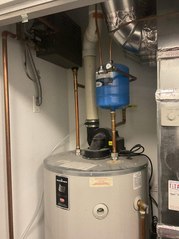 Completed installation of a replacement 75-gallon water heater in utility closet as requested by customer. Installed new expansion tank with proper copper pipe connections and verified all components are functioning correctly. System includes proper valving and meets all code requirements with no leaks observed upon final inspection.